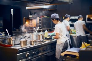 chefs-work-in-restaurant-kitchen