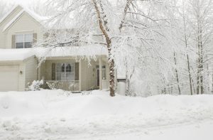 beige-house-covered-in-snow